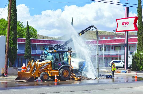 The City of Alpine works on a water leak Monday afternoon in front of the OYO hotel. Workers inside the hole cool off a bit during the repair as water shoots into the air from the waterline on East Holland Avenue. Photo by Kara Gerbert