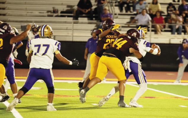 Two Kermit players contend with an Alpine player during the Buck’s matchup last Friday night. Courtesy photo