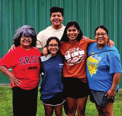 Joining Payne are family members Alec Ramos in back, and Luisa Payne, Elyse Ramos, Aneesa Payne, and Cynthia Payne. Avalanche photo by Roxanne Hill