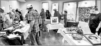 Visitors to last year’s Wild West Night hosted by the Sunshine House browse silent auction items donated by local artisans and businesses. This year, the annual event is being held on October 14. Avalanche photo