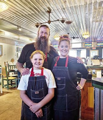 Owners of Sky Island Culinary recently held a pop-up dinner at Alcove Social, formerly the Saddle Club. Pictured in front is Zoe Wood, and in the back are Stephen and Libby Wood. Photo by Kara Gerbert