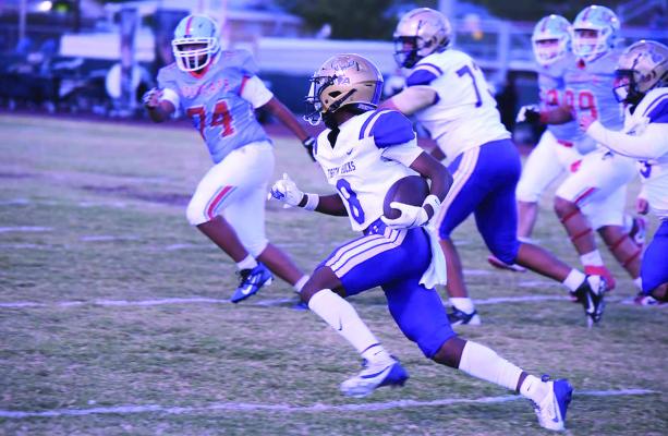 Dae Hardwick carries the ball towards the endzone in the Bucks match-up against the Anthony Wildcats this past season. Photo by Noe Lujan