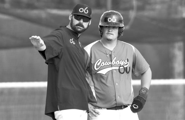 Cowboys Manager Sean Persky breaks records with most all-time wins for the Cowboys. Persky is seen here talking strategy with Peyten Kennard All-Star Player and one of the catchers for the Cowboys. Courtesy photo