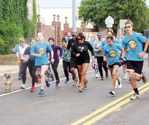 Locals took off running in front of Kokernot Field this past weekend for the annual Alpine Cowboys Home Run 5k and 10K. Courtesy photo