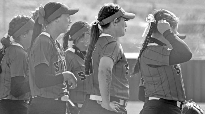 The Sul Ross softball team stands on their home Lobo Softball Field during their last game with Hardin-Simmons University. Photo by Brylee Sweeten