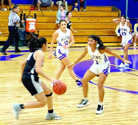 Lady Bucks Hope Dominguez covers and defends against a Lady Mustang from Fort Hancock in Alpine.