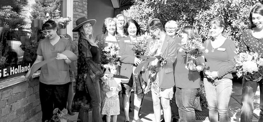 Outwest Floral had their official ribbon cutting ceremony on April 27. Pictured are Julie Edwards, owner Katy Ceynowa, Lainey Ceynowa, Eva Olivas, Debbie Jordan, Sarah Bow, Judy Stokes, Gerri Davis, Mayor Catherine Eaves, Dona Ward, and Alyn Covington.