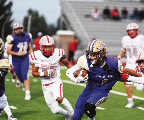 Matthias Prieto attempts to break away from Van Horn’s Asher Martinez during the Bucks’ win over the Eagles last Friday night. Photo by Felipe Fierro