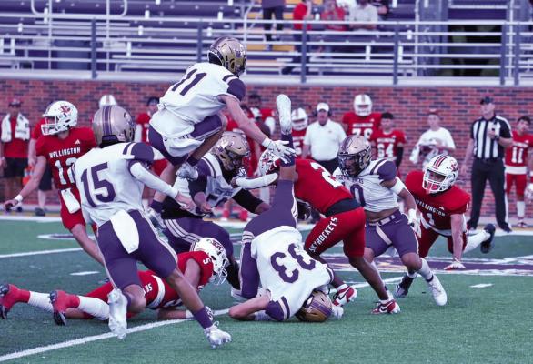 In a gritty, penalty-ridden game, the Fightin’ Bucks fought hard to keep the Skyrockets out of the endzone last Friday night. Despite impressive plays from Dae Hardwick and Logan Smith, the Bucks struggled against the larger players of Wellington. Photo by Noe Lujan