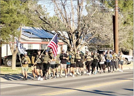 Area law enforcement members from all branches hit the streets of Alpine last Friday morning for the 10th Annual Fallen Heroes Honor Run, to bring attention to those officers who gave their all, sacrificing for the safety of others. Runners included members of the Alpine Police Department, Brewster County Sheriff’s Office, Texas Department of Public Safety, DEA, U.S. Border Patrol, and the U.S. Marshal’s Service who put on the run each year. Photo by J.T. Maroney