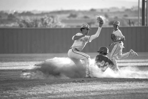 Jace Canaba slides into base during the Alpine Bucks game against the Presidio Blue Devils. Photo by Annika Canaba-AMC Photography