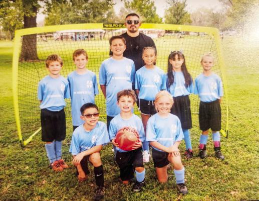 The Alpine 8U Strikers with Coach Rafael De Leon. Courtesy photo