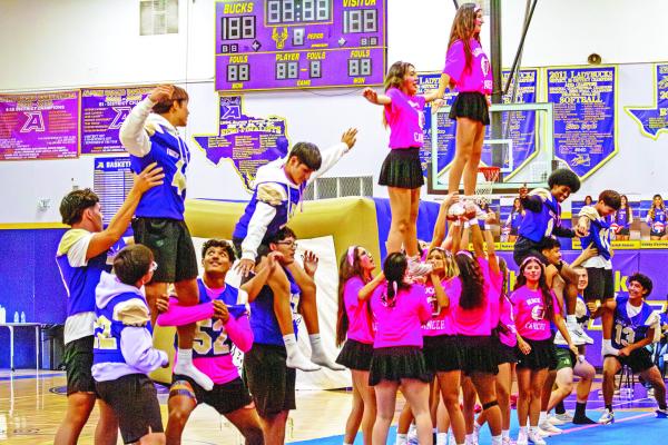 The Alpine High School cheerleaders recruited a few new members to their squad during last week’s pep rally. Several of the Bucks’ football team participated in this pyramid routine, attempting to pull off the gracefulness our Lady Buck Cheerleaders exhibit regularly. Photo by Kara Gerbert