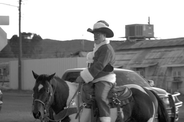 Santa saddled up his cow pony Saturday night and made an appearance at the City of Alpine’s annual Christmas Parade. Photo by Joh Covington