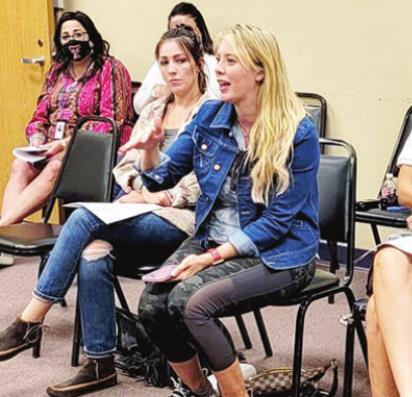 Alpine parent Lacy Schniers addresses board members on school security options at the meeting on July 20. Avalanche photo by Roxanne Hill