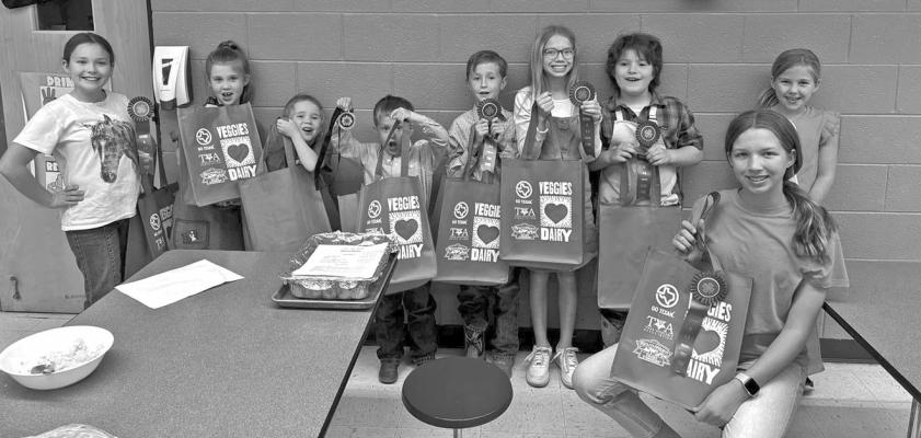 Students in local area 4-H clubs participated in a food show and food challenge last Friday evening at the Alpine Elementary School cafeteria. Individuals pictured competed in the food show, bringing a dish they made along with a presentation about the food, and presenting the dish to judges who asked questions and judged on the presentation, content, and nutrition knowledge of their dish. Photo courtesy of Emily Hendryx
