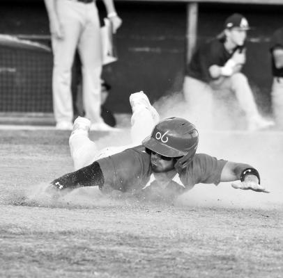 Cowboys second baseman Alex Canty slides into home plate during the Cowboys’ 10-1 win over the Austin Weirdos at Kokernot Field Saturday, June 3. Photo by Julie Meyers
