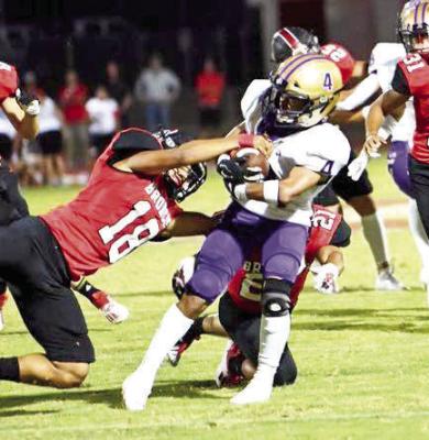 Fightin’ Buck Aiden Garcia clutches the ball on a run against the Broncos in Sonora in 2021. Courtesy photo