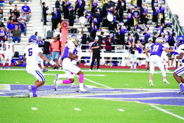 Senior quarterback Dae Hardwick scrambles to find yardage in Friday night’s upset by the Golden Cranes. Photo by Felipe Fierro