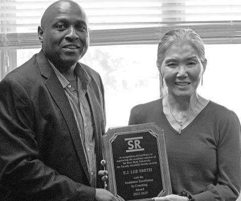 Dr. Eric Busby, President of the SRSU Faculty Assembly, presented the Academic Excellence in Coaching Award to Coach E.J. Smith. Courtesy photo