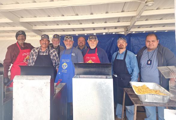 Our Lady of Peace Catholic Church’s Knights of Columbus held their annual fish fry on Friday, March 14, at the Parish Hall. Proceeds go to help out less fortunate members of the community. From left are Carlos Rodriguez, Danny Flores, Bill Broyles, Dwain Tarango, Father Saul Pacheco, Bucho Garcia, Michael Sanchez, and Grand Knight Manuel Martinez. Photo by Kara Gerbert
