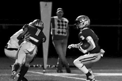 Alpine Fightin’ Buck Senior, Elijah Villanueva (#1) blocking as Logan Smith (#3 ) scores one of his two touchdowns. Smith rushed for over 178 yards. Photo by Felipe Fierro