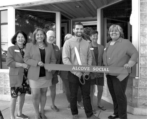 Alcove Social, formerly The Saddle Club held its ribbon cutting ceremony and grand opening Wednesday, July 26. Pictured are Sara Bow Gluck, Eva Olivas, Rick Kelly, Geri Davis, owner Benjamin Garcia, Judy Stokes, and Berta Rios-Martinez. Photo by Joh Covington