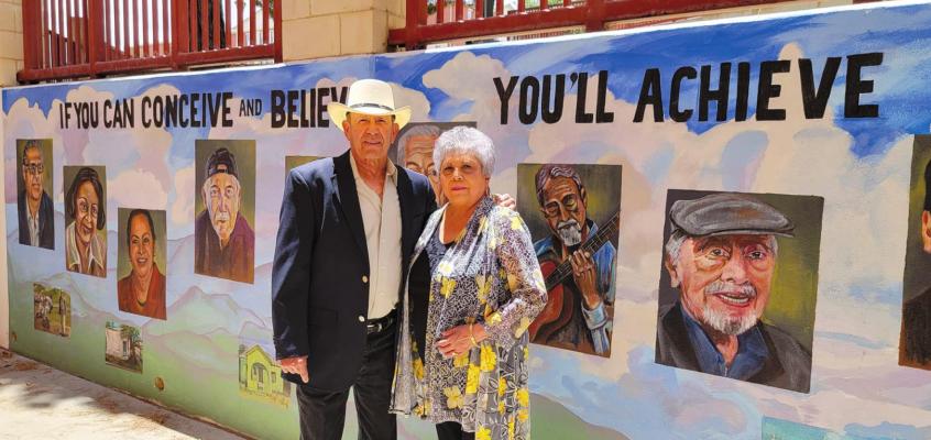 Robert and Elidia Polanco of Alpine stand outside the murals on the Sul Ross campus. Avalanche photo by Roxanne Hill