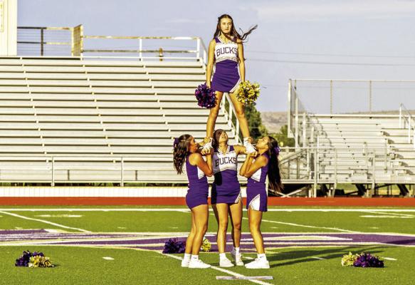 The AHS cheerleaders performed stunts and cheers to pump up the crowd last Wednesday night during Meet the Bucks. Photo by Kara Gerbert