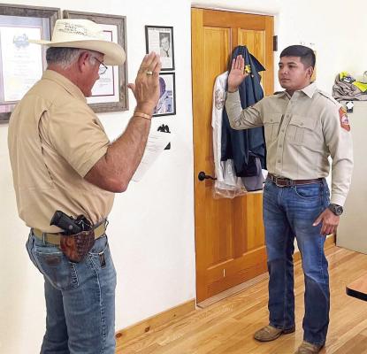 Dereck Campos, a recent graduate of the Sul Ross Law Enforcement Academy, was sworn in by Sheriff Ronny Dodson on Monday. Campos will begin his field training this week with various certified training deputies throughout the county. Photo courtesy of BCSO