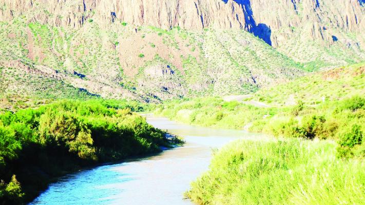 The Rio Grande rolls through the canyons along Hwy 170 in Presidio County alongside Big Bend Ranch State Park, as seen from Terlingua Ghostown owner Bill Ivey’s multi-generational family property. Photo by Kara Gerbert