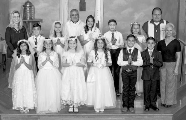 OLP celebrates First Communion