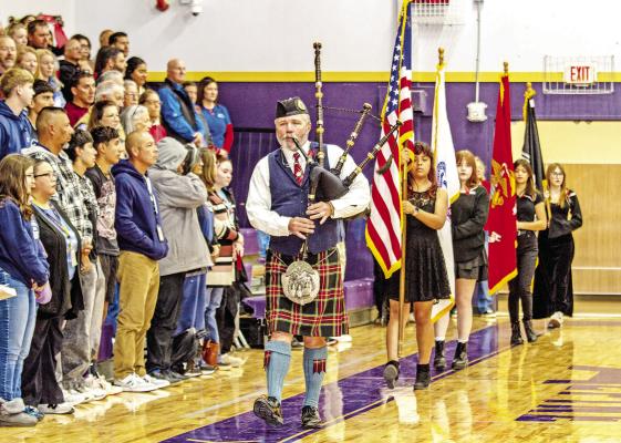Thomas Hyatt, a piper with the U.S. Border Patrol, leads the color guard during the Veterans Day ceremony on Tuesday morning held at the Alpine High School. See more Veterans Day photos on page 14. Photo by Kara Gerbert