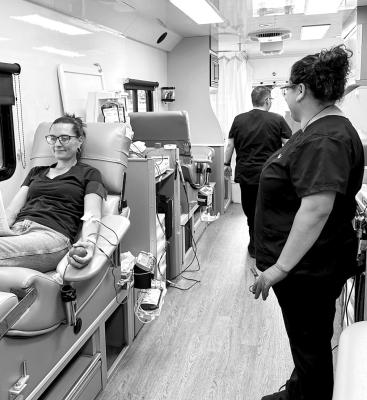 The Alpine Police Department hosted a blood drive earlier this week at the station. Bianca Castillo stands by while Taj Lewis relaxes as she donates to this cause. Photo by J.T. Maroney