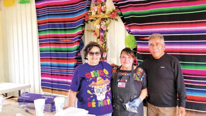 Rena Gallego, Velma Flores Valero, and Mike “Coach” Pallanez pause for a photo at a recent Holy Angels Cemetery Association Cinco de Mayo barbecue fundraiser. Avalanche photo by Roxanne Hill