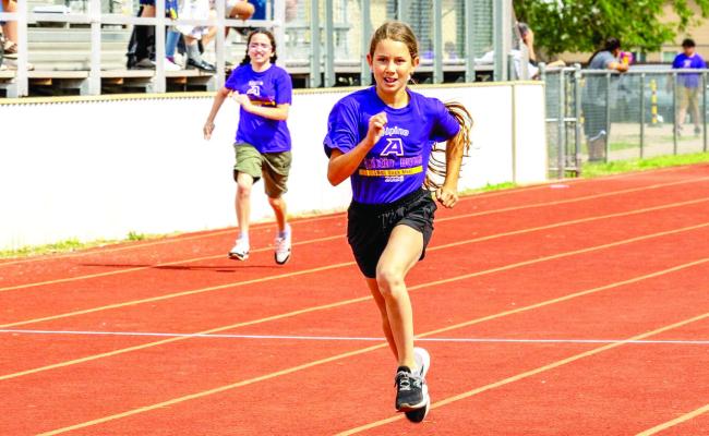 Lauren Aragon (foreground) and Sophie De La O push towards the finish line in last Friday’s 5th and 6th grade track meet held at Buck Stadium. Courtesy photo