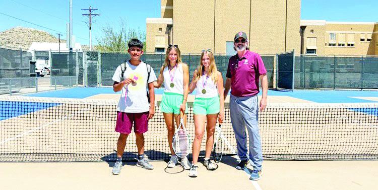Mustang tennis players Sadie Carter and Annalise West earned the championship spot for girls’ doubles at the district tournament, which advances them to the regional tournament, while Marco Briones placed third in the boys’ singles. From left are Briones, Carter, West, and their coach, Dr. Brett Green. Courtesy photo