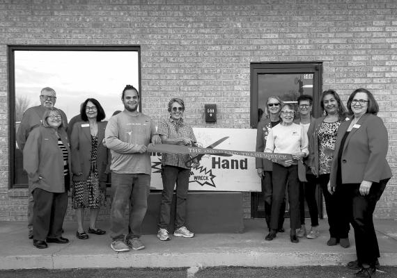 The Second Hand Train Wreck held their ribbon cutting ceremony Tuesday morning at 508 E. Ave. E. Pictured are owner Lisa Lanier, her mother Maurine Pendleton, Nick Miller, and Alpine Ambassadors Sheila Johnson, Jerry Johnson, Sara Bow, Rhonda Cole, Judy Stokes, Eva Olives, and Debbie Jordan. Avalanche photo by Kara Gerbert