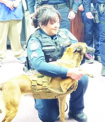 Sgt. Valerie Kettani, who is the Alpine Police Department’s K-9 officer, assists K-9 officer Prada in swearing to uphold the duties of an officer for the APD. Prada is pictured wearing her newly donated ballistic vest. Photo by Kara Gerbert