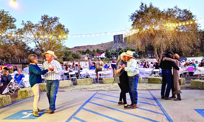 Supporters of the Sunshine House’s Wild West Night dance to the familiar songs played by Craig Carter and the Spur of the Moment Band. Photo by Kara Gerbert