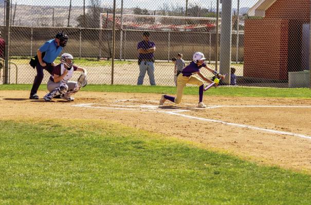 Senior softballer Emy Hernandez attempts a bunt at the plate last week against Midland Legacy. Courtesy photo