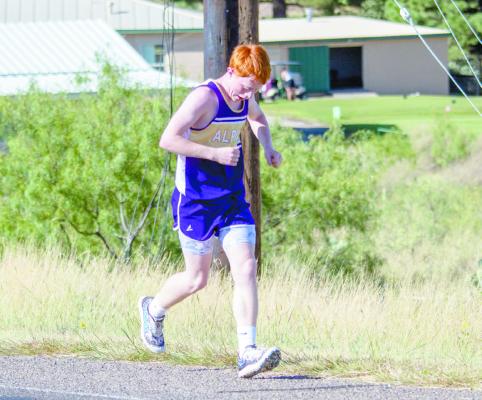 Ty Ritchie powers through the hill at Saturday’s crosscountry race held at Kokernot Park. Photo by Kara Gerbert