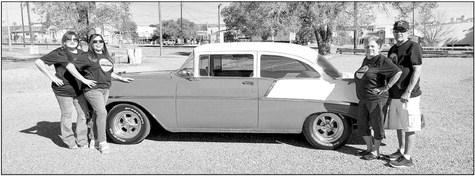 The organizers of Fiesta 1888 in Alpine, Mary Ann Lujan, Annette Gallego, and Elidia and Robert Polanco proudly stand by a classic ride, a 1956 Chevy 210, owned by Chris Jimenez and family of Alpine. The event will include a classic car parade and car show, legendary Tejano singers, an evening dance, and more, on Saturday, Aug. 20 at downtown Historic Murphy Street. Avalanche photo by Roxanne Hill