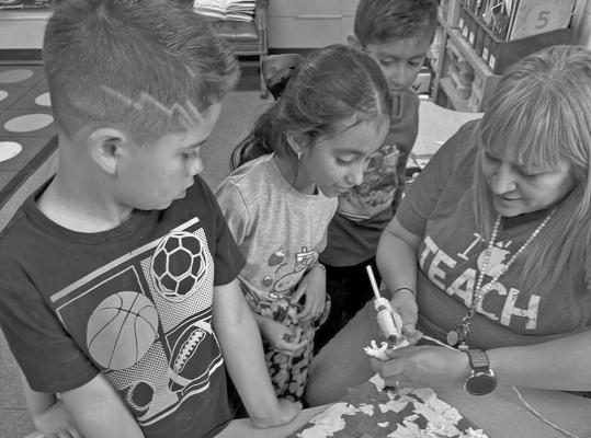 First graders in Mrs. Galindo’s class worked on creating animal habitats last week as part of their study on animal adaptations. Students created deserts, rainforests, and everything in between as they learned how animals survive and thrive in their different environments. Courtesy photo