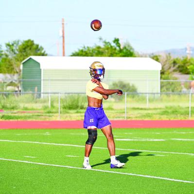 Dae Hardwick works on passing drills during practice at Buck Stadium. Photo by Kara Gerbert