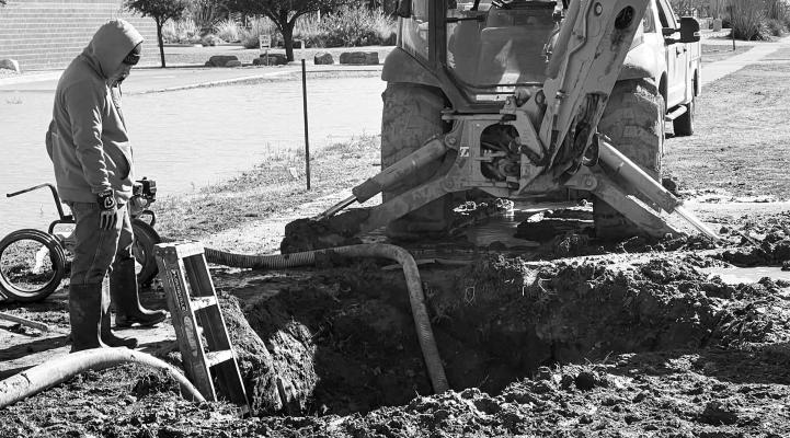 City of Alpine water department workers work over the Christmas holiday to repair a break in a main water line in front of the DEA building. The city is still under a boil water notice. Courtesy photo