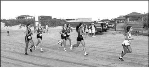 Molly Garrett, Colette Fowlkes, Emy Hernandez, and Hope Dominguez, members of Alpine High School’s varsity girls’ cross country team compete on the beach at Port Aransas this past weekend. Courtesy photo