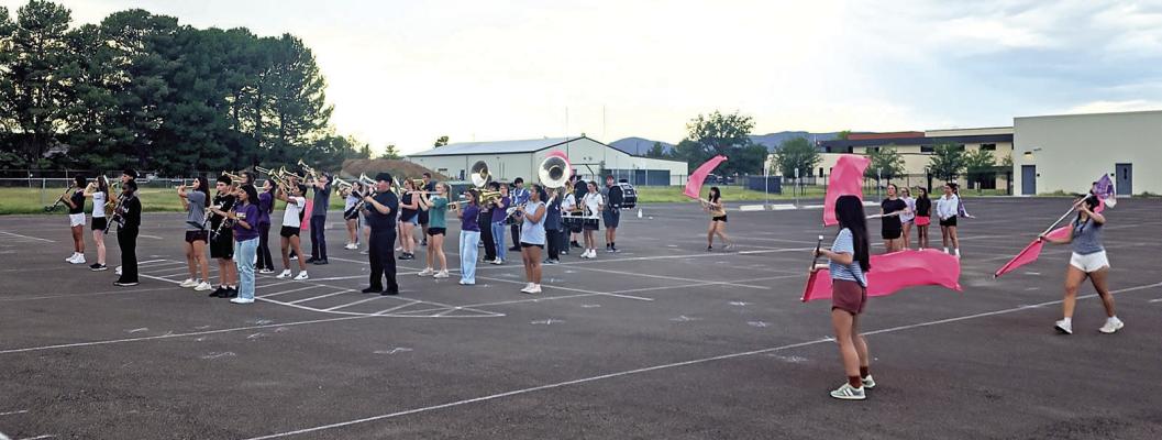 The Alpine High School marching band and color guard have been hard at work since July, practicing and perfecting their music selections and marching configurations in the parking lot just south of Alpine High School. Photo by Kara Gerbert
