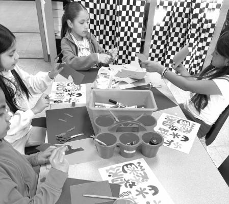 Second graders at Alpine Elementary have been studying the art world, notably a particular artist, Henri Matisse. Matisse, famous for his cut-out art, helped inspire these students through the book Henri’s Scissors and they worked to create their own masterpieces. Courtesy photo.