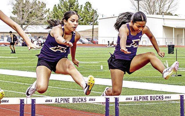 Freshman Jianna Martinez and Rose DeGuia are neck and neck as they clear their final hurdles on Saturday afternoon at Buck Stadium. Photo by Kara Gerbert